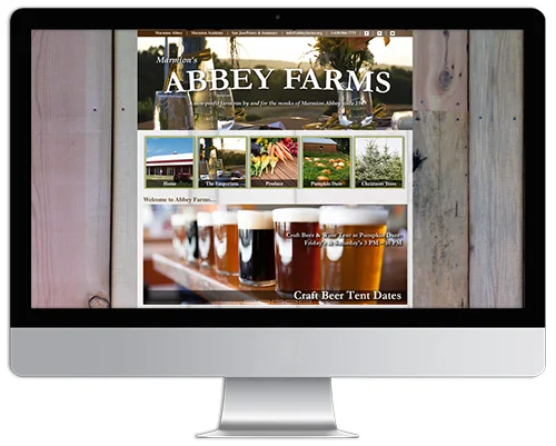 Website project displayed on a desktop monitor
